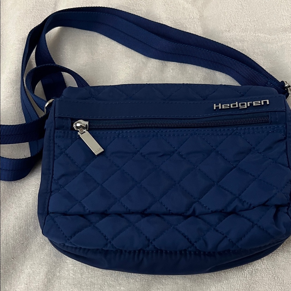 Hedgren Carina Crossbody Travel Bag in blue quilted nylon with adjustable strap
